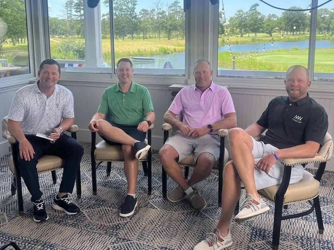 Four GVA colleagues seated together for a conversation